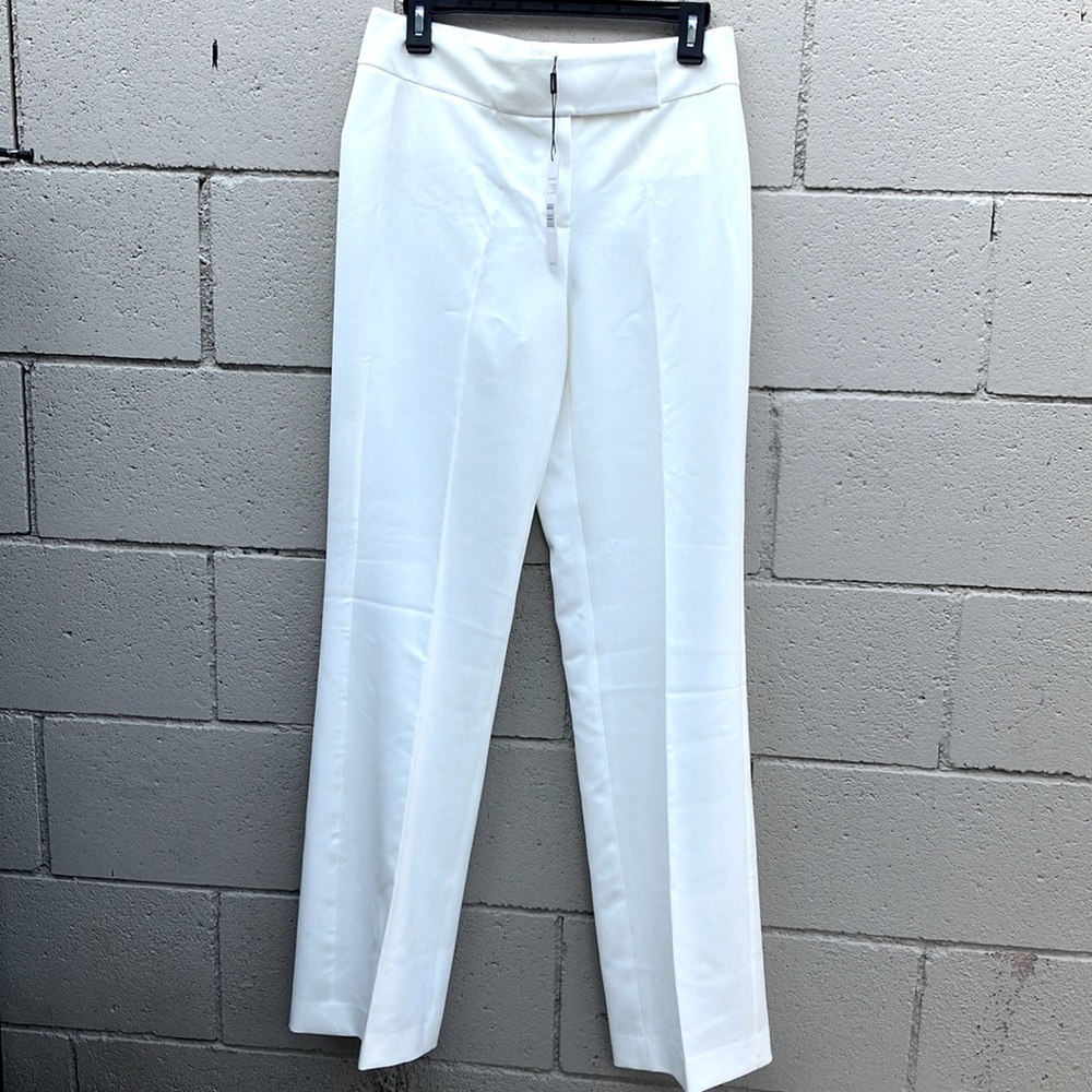 Tahari cream color dress pants. With faux pockets on the back.  NWT